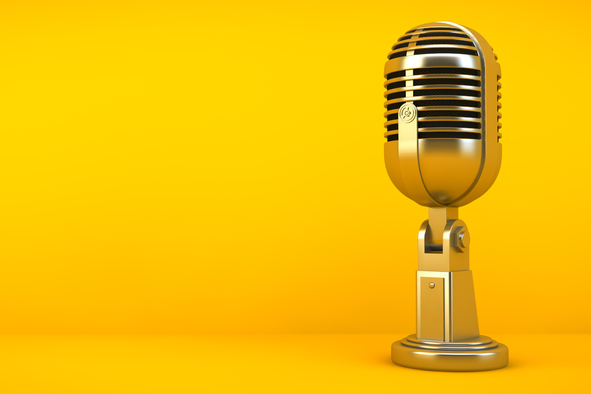 gold microphone on yellow background 3d rendering